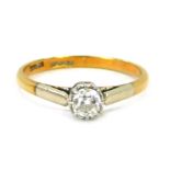An 18ct gold and platinum diamond solitaire ring, with old cut diamond in illusion platinum setting,