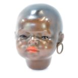 A Heubach Koppelsdorf German porcelain bisque doll's head, No 399.30.D.R.G.M.