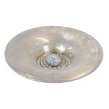 An Eastern inspired rose bowl, the flared outer rim inset with a central oval stone and button set e