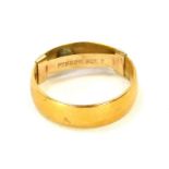 A 22ct gold wedding band, of plain design with a 9ct gold ring sizer link, ring size N, 3.9g.