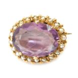 A 9ct gold amethyst and seed pearl set bar brooch, the oval faceted amethyst in eight claw setting s