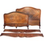 A 19thC French walnut single bed head and foot, with side rails.