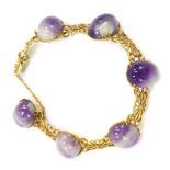A 9ct gold amethyst bracelet, with polished cabochon stones and daisy link bracelet, the sliding cla