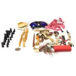 A metal money tin, and contents of gold plated gate bracelet, sunglasses, chess pieces, brooches, et