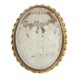An early 20thC shell cameo brooch, with heavily carved relief religious scene, with buildings in the