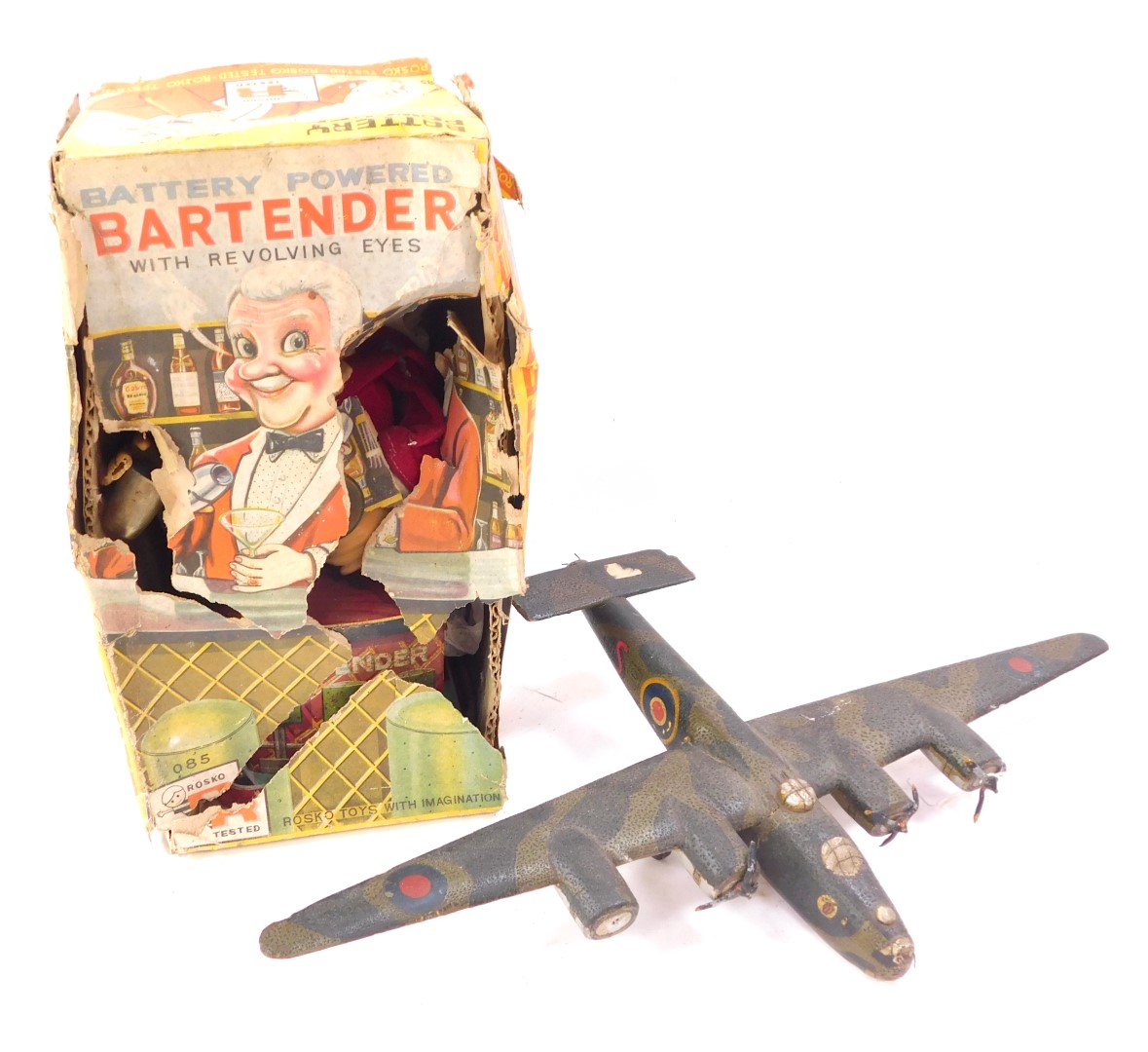 A scratch built model of a Liberator B24 Bomber, and a tin plate battery operated bar tender made by