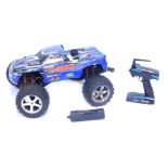 A Traxxas T Max remote control monster truck, with two channel 2.4GHZ controller.