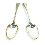 A pair of Victorian silver Fiddle pattern serving spoons, each bearing the initial F, London 1899, 3