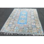 An eastern rug, with a design of three medallions, in pastel colours, 278cm x 207cm.