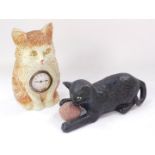 A late 19thC/early 20thC Bretby black painted terracotta model of a cat, with a ball of string, impr