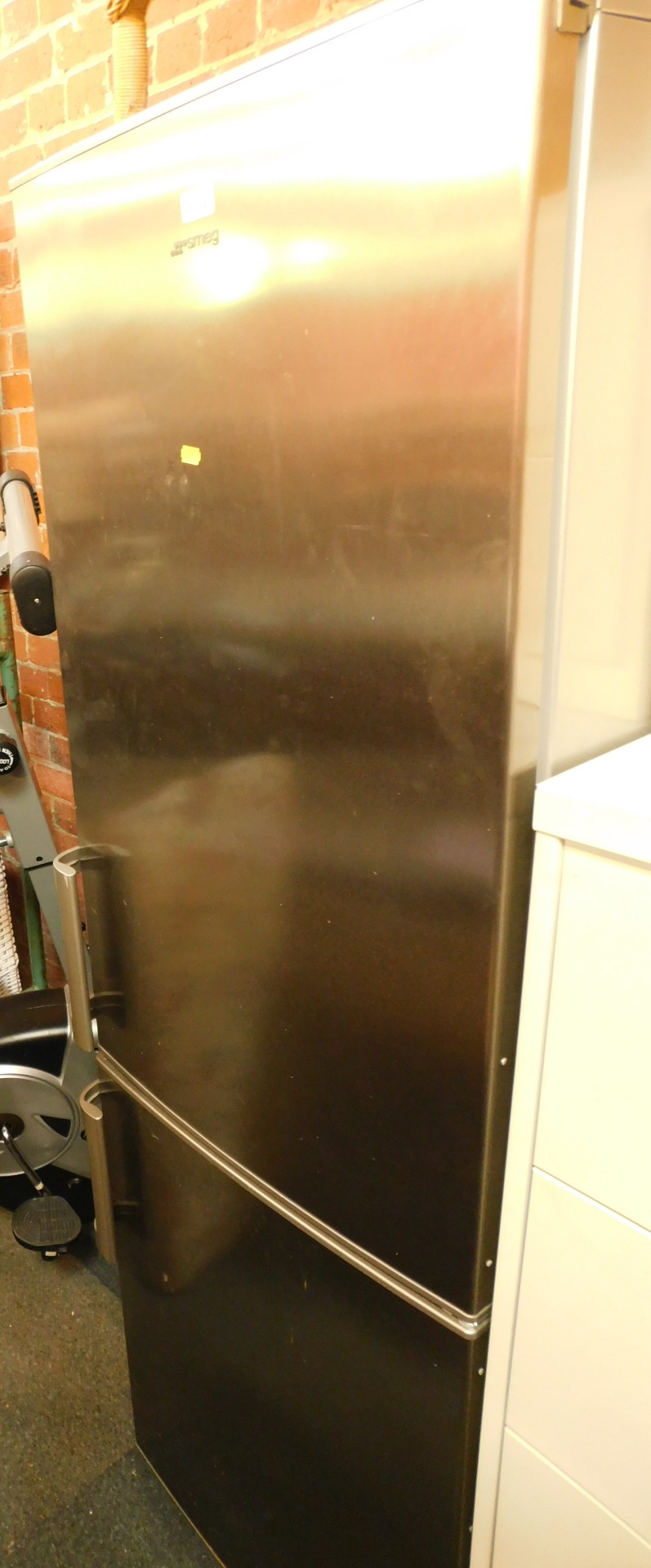 A SMEG stainless steel fridge freezer.