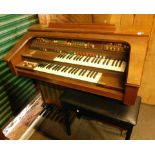 A Solina K150 electric organ, with stool.