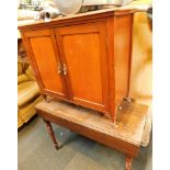 A walnut two door pot cupboard, and a oak drop leaf table. (2)