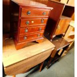 A group of furniture, comprising a drop leaf kitchen table, tea trolley with fall flaps, bedside cab