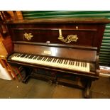 An Elysian Chappell Piano Company upright piano, in mahogany case with brass sconces, 131cm high, 14