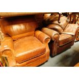 Two leather armchairs, comprising a brown leather studded armchair and a tan leather armchair. (2)