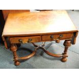 A reproduction walnut drop leaf coffee table, with X frame base and single drawer.