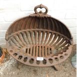 A cast iron fire grate.