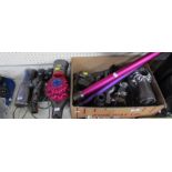 Two Dyson hand held vacuum cleaners and accessories.