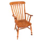 An ash and elm lath back grandfather chair, with shaped arms, 113cm high, 58cm wide.