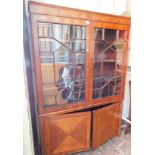 A 19thC mahogany display cabinet, the cross banded top above astragal glazed doors, with two cupboar