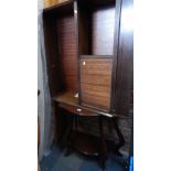 A demi lune side table and a mahogany bookshelf.