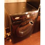 A Whirlpool Six Sense washing machine, black.