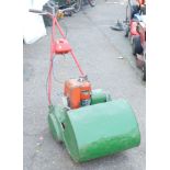 A Suffolk Punch petrol mower.