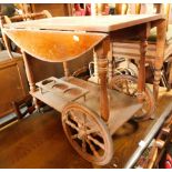 A teak drinks trolley.