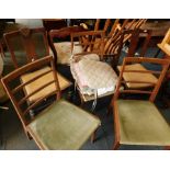 A set of four dining chairs, with green upholstered seats, and a wooden dining chair, and four seat
