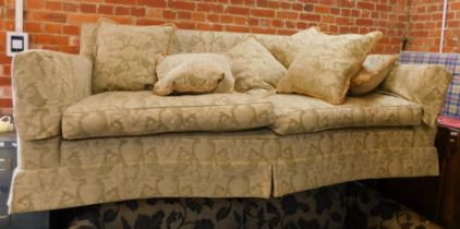 A Duresta style two seater sofa, with a shaped front, with cream vase and flower design, 235cm wide,