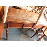 A 19thC mahogany fold over tea table, with a figured panel to the centre on turned tapering legs, 75