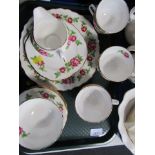 A Royal Vale part tea service decorated in pink roses pattern, comprising six cups and saucers, milk