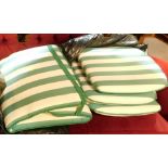 A group of seat cushions. (a quantity)