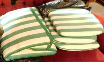 A group of seat cushions. (a quantity)