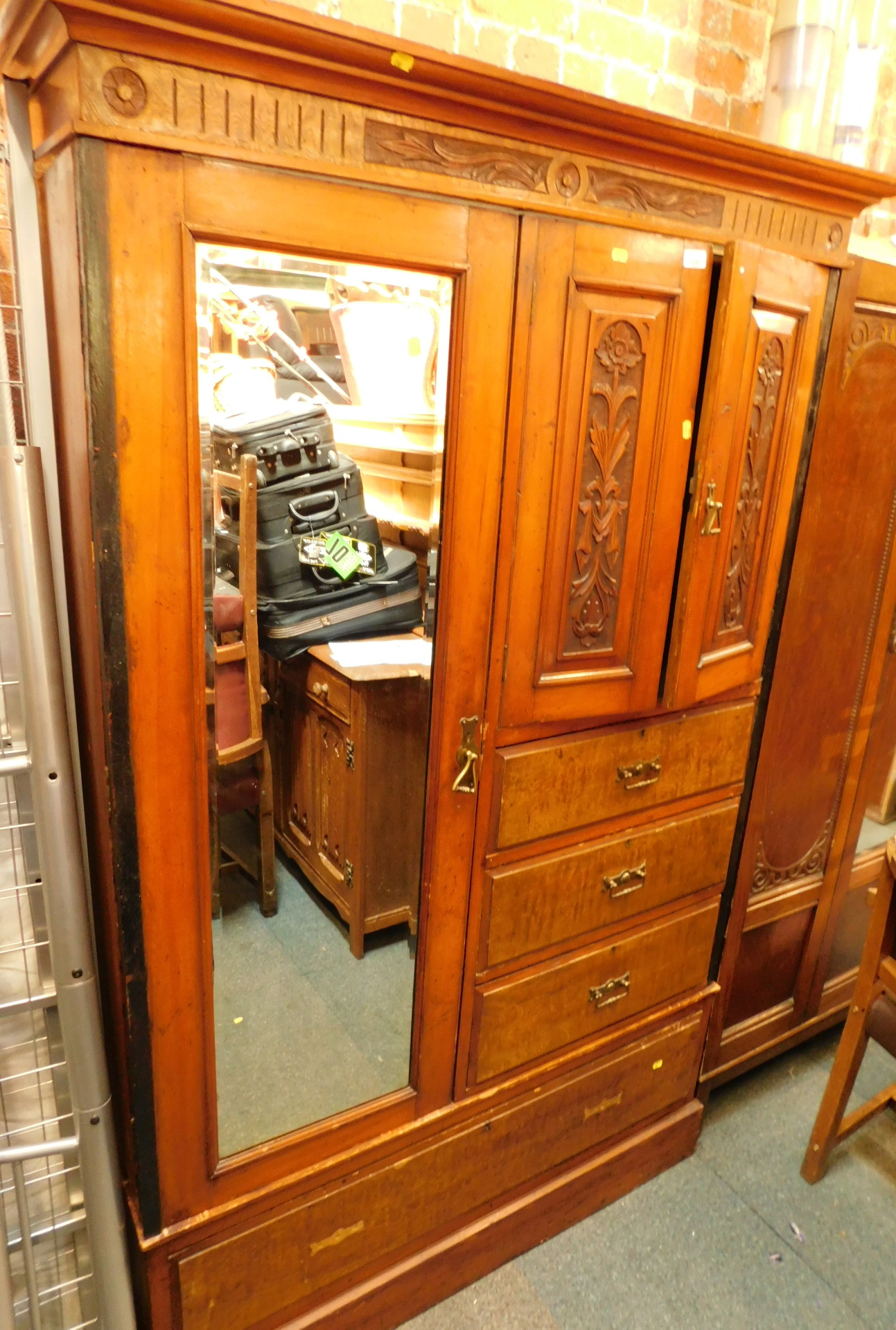 A Victorian walnut and Hungarian ash single wardrobe, with carved and paneled top, with single drawe