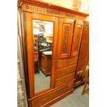 A Victorian walnut and Hungarian ash single wardrobe, with carved and paneled top, with single drawe