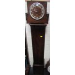 An oak mantle clock and a clock case stamped pedestal.