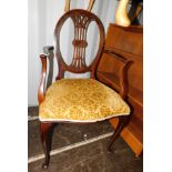 An Edwardian mahogany and inlaid open armchair.