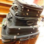 A group of modern suitcases, Dunlop and others. (4)