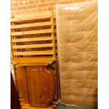 Two pine single bed frames and mattresses.