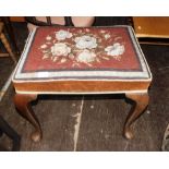 A walnut stool, with needlework seat.