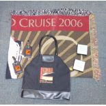 A group of QEII World Cruise 2006 Voyage of the Seven Wonders memorabilia, including glass