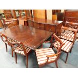 A Regency style dining suite, comprising sideboard, table and six chairs. The upholstery in this lot