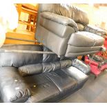 A black leather three seater and two seater sofa set. (2)