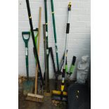 A group of gardening tools, window cleaning brush, rakes, brushes, car mats, plastic ornament of a f