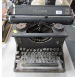 A vintage Imperial typewriter, in black with chrome trim.