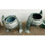 A pair of metal fish planters, each with shrimp arms painted in green and silver.