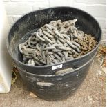 Galvanised chains and two plastic tubs.