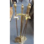 A 20thC brass fireside set, with leaf moulded base, with four implements.